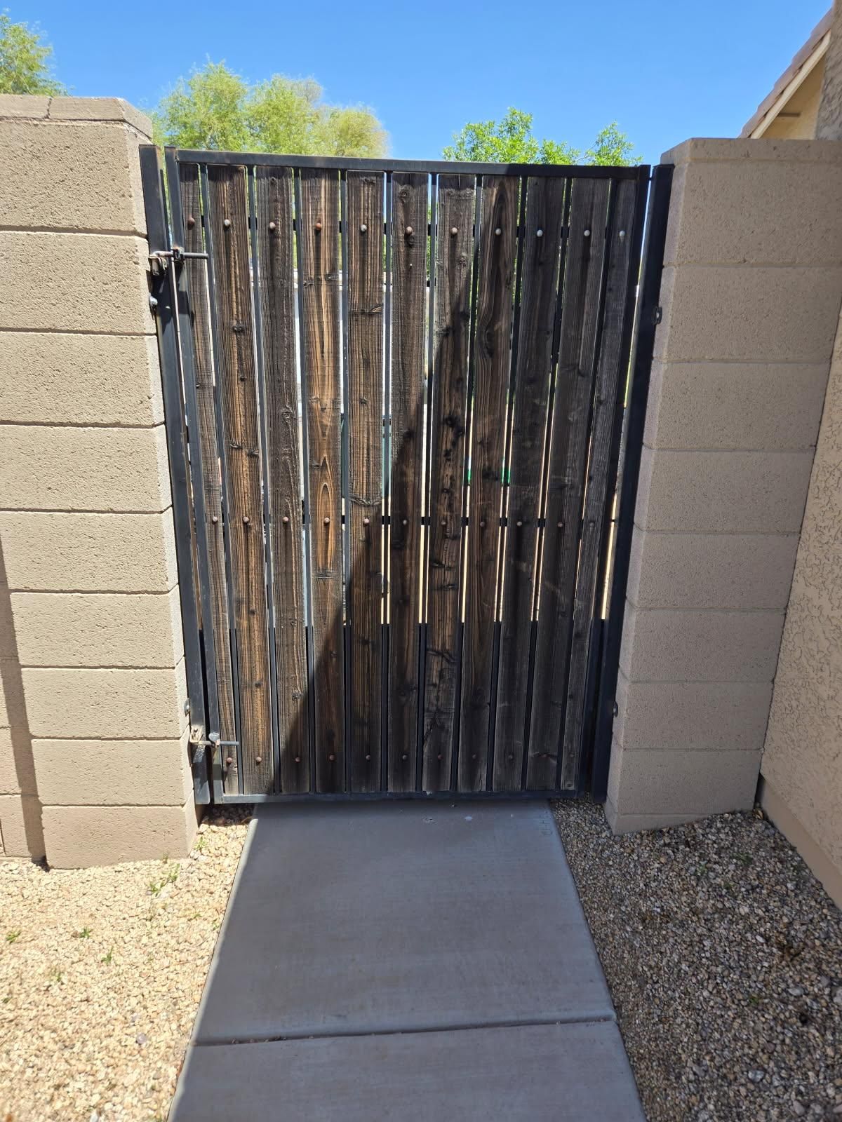 Gate with old weathered slats before refurbishment